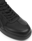 Black high-top sneaker on a white background