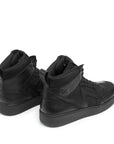 Black high-top sneakers on a white background