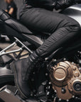 woman's legs on a motorcycle wearing slim-fit motorcycle jeans from Pando Moto