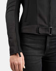 Person wearing a black jacket and pants on a white background