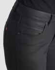 A side of woman's legs wearing slim-fit motorcycle jeans from Pando Moto