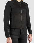 Black jacket with mesh panels worn by a person on a light gray background