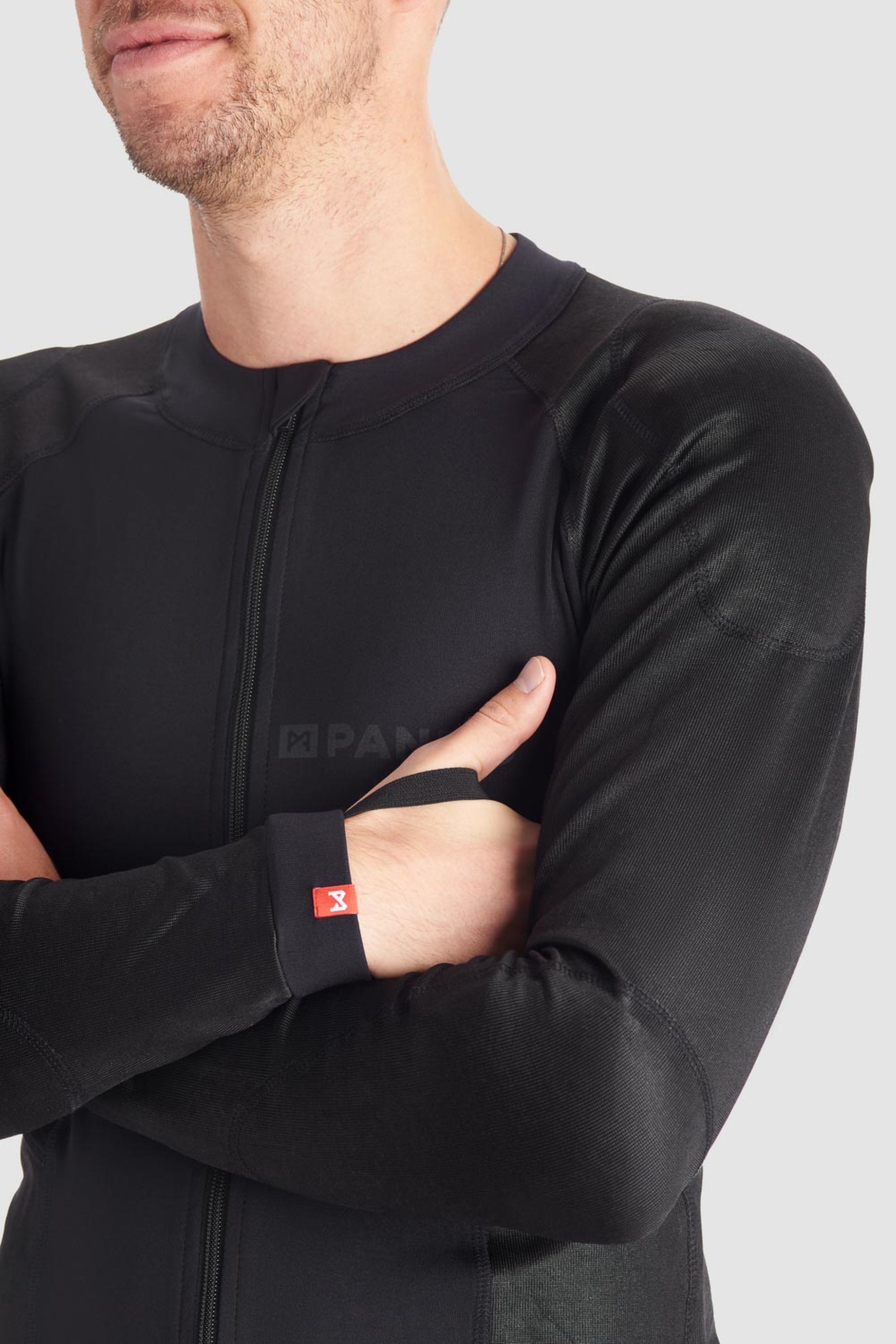 a man wearing Pando Moto black base layer shirt