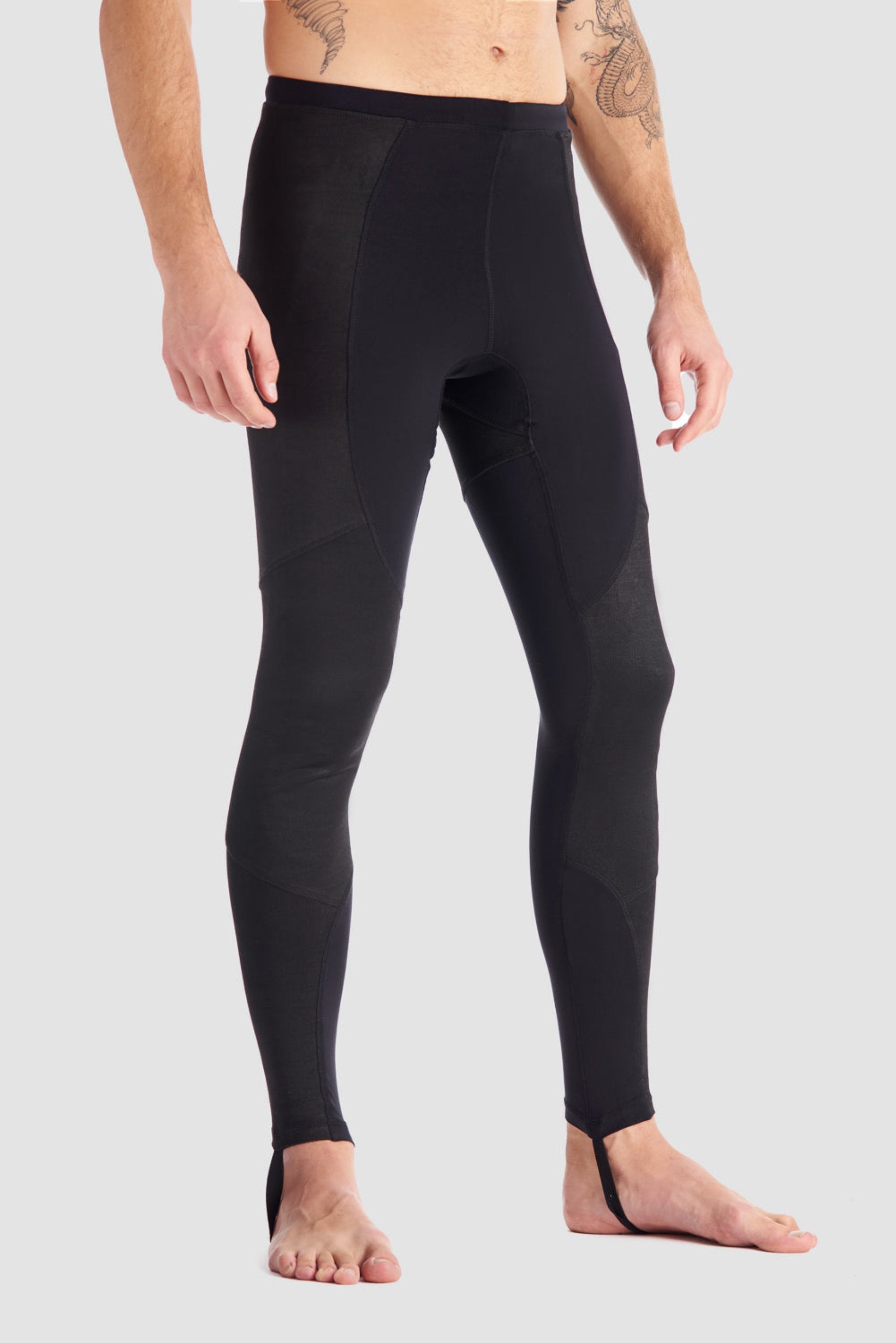 a man wearing black base layer leggings