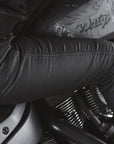 A woman on a motorcycle wearing women's black motorcycle jeans Lorica Kevlar from Pando Moto