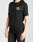 A black haired woman wearing Pando Moto motorcycle t-shirt with the logo