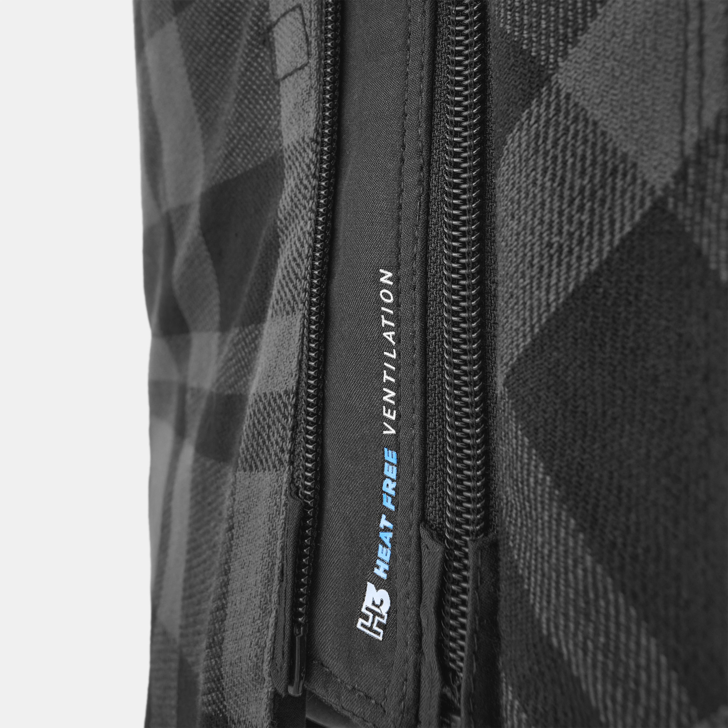 Close-up of a black textured bag with a zipper and 'H3' branding.
