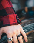 close up of sleeve with zipper detail on red and black flannel-style women's jacket from moto girl