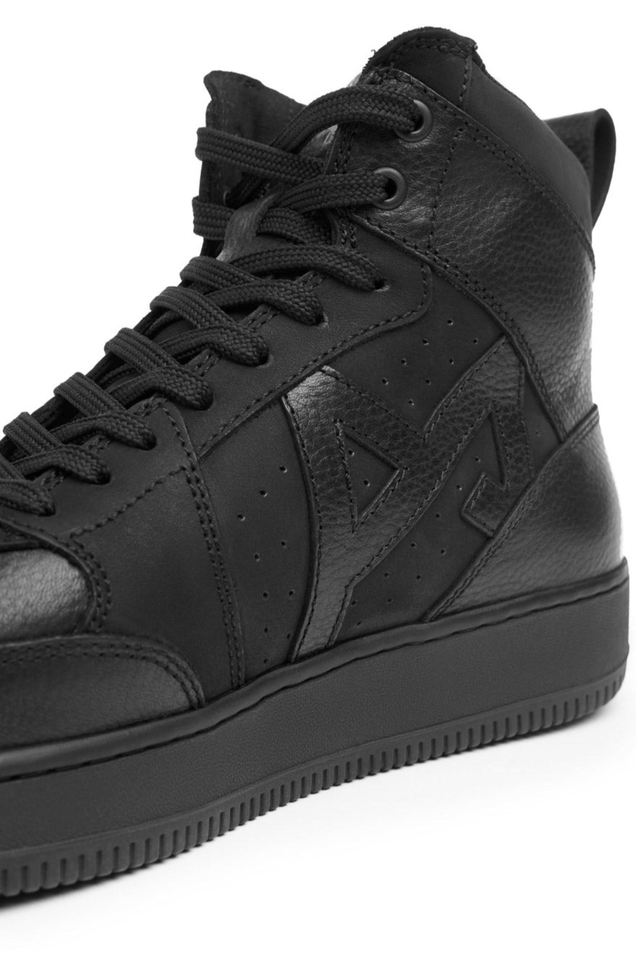 Black high-top sneaker on a white background