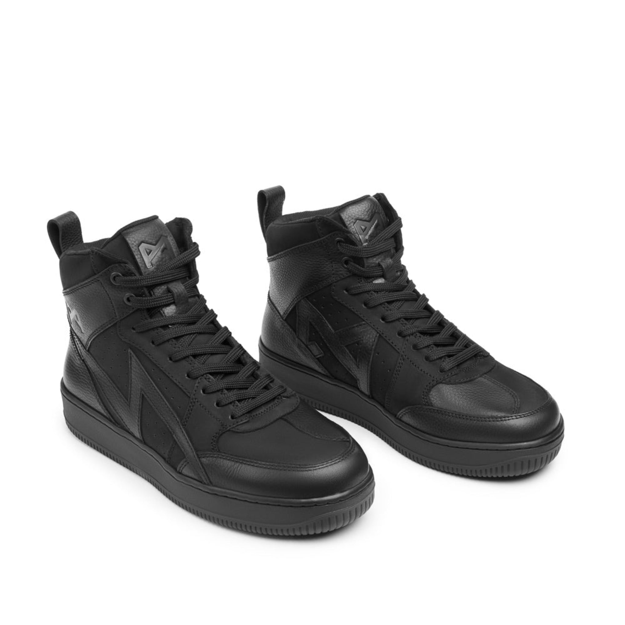 Pair of black high-top sneakers on a white background