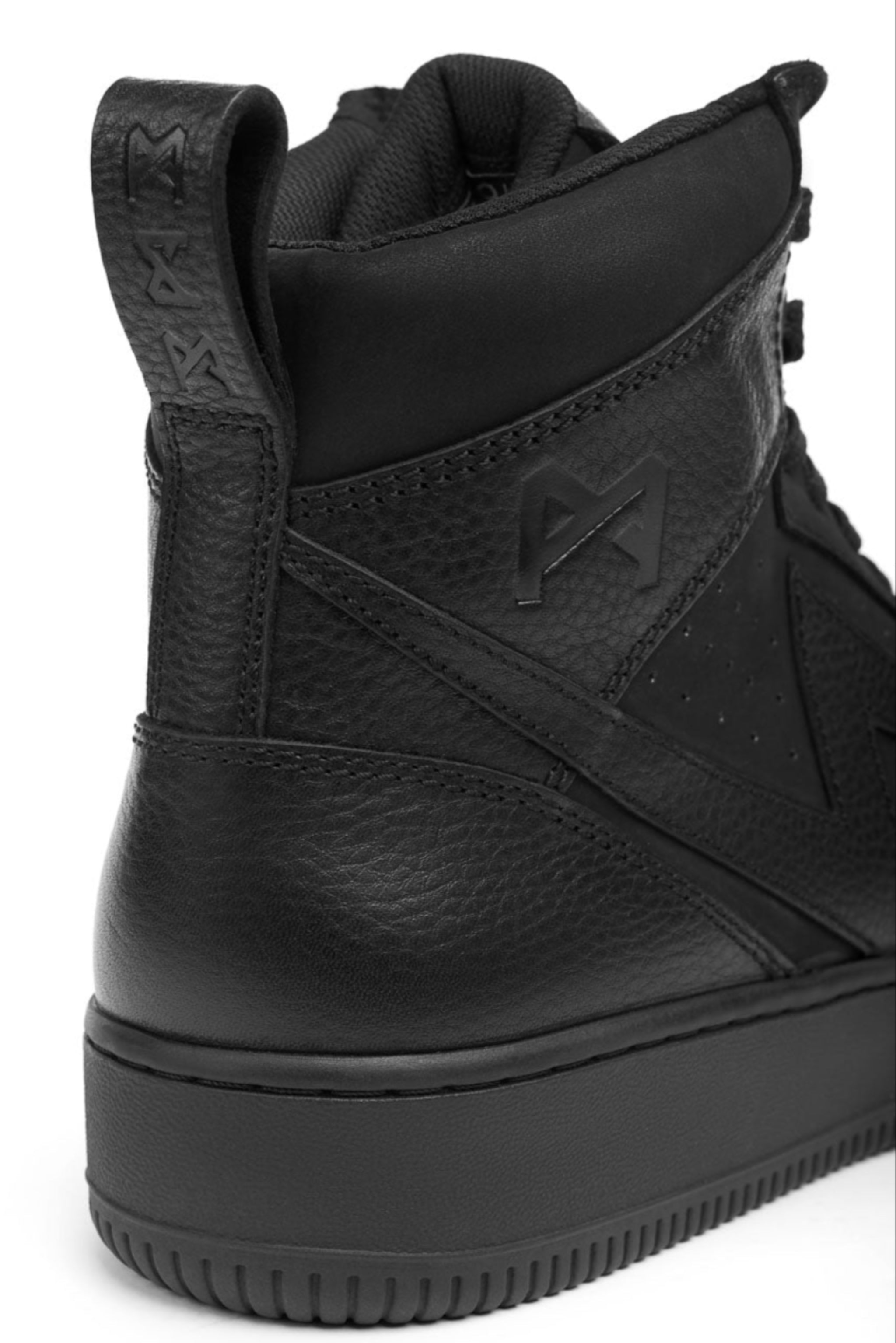 Black high-top sneaker with brand logo on a white background