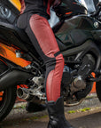 Woman sitting on motorcycle wearing Red Fiona Motorcycle Trousers from Moto Girl