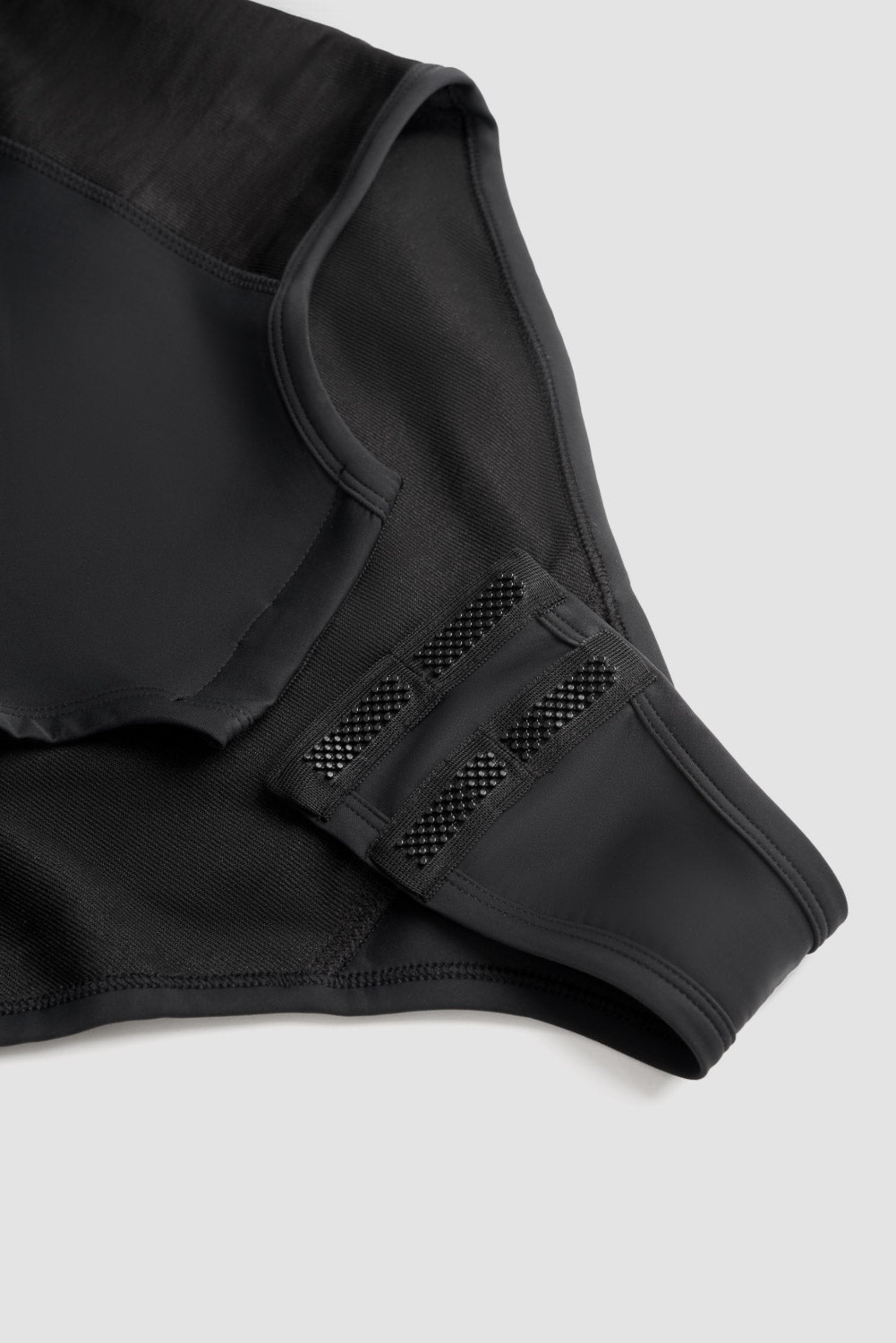 a crotch closure of a black body suit base layer for women from Pando 