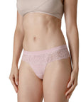 Women wearing nude-colored thongs with lace waistband details from Tramonte.