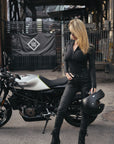 A slim woman wearing slim-fit motorcycle jeans from Pando Moto 