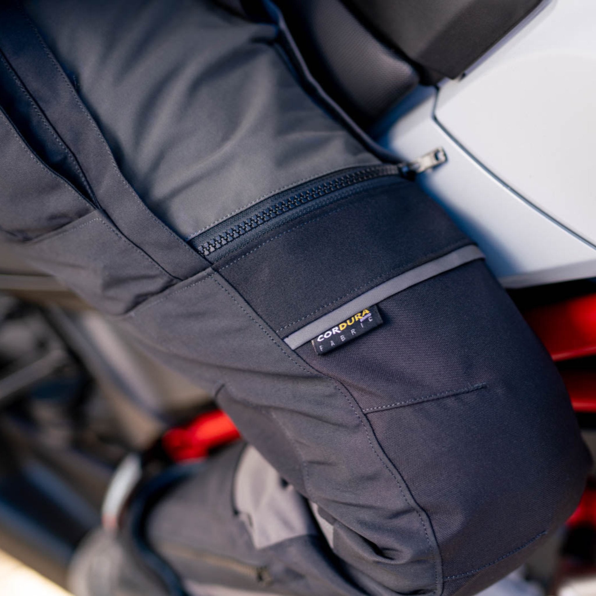 A close up of the leg zipper on the women motorcycle touring pants