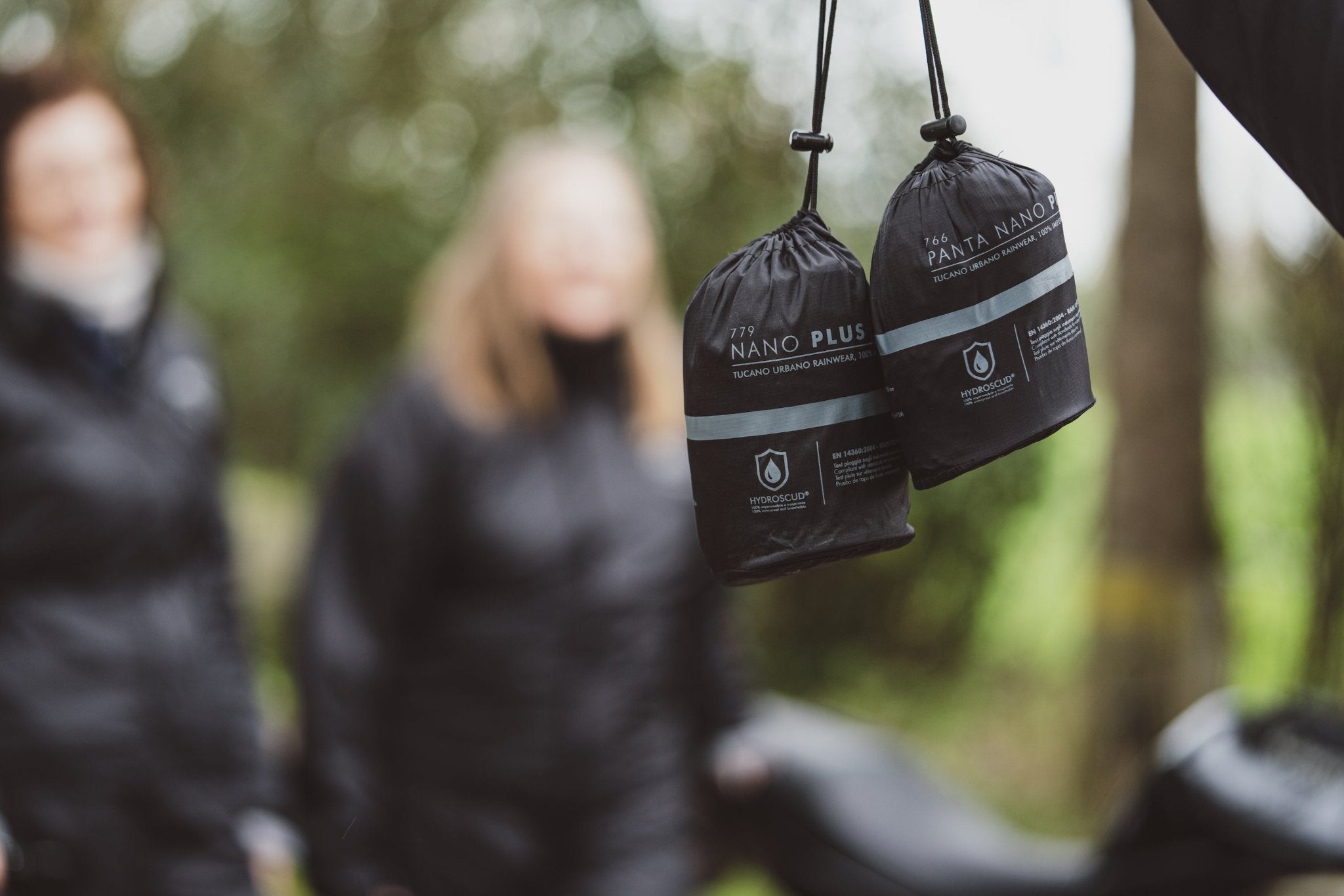 two small bags with Nano Plus rain clothes