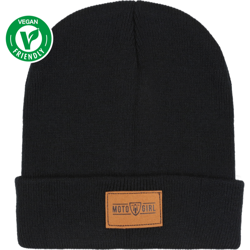 Black beanie from MotoGirl with a brown faux leather tag on the front featuring the MotoGirl logo, and a 'Vegan Friendly' logo in the corner.