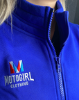 close up of woman's neck wearing Motogirl clothing blue sweatshirt with a front zip