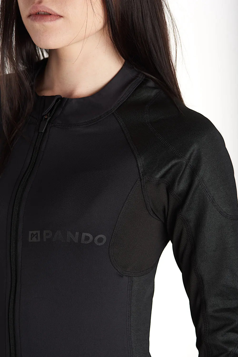 A woman wearing black tight motorcycle underwear with Pando Moto Logo