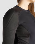 a close up of woman's shoulder wearing black motorcycle body suit from Pando Moto 