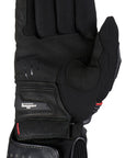 a palm of Furygan black long motorcycle glove with red details