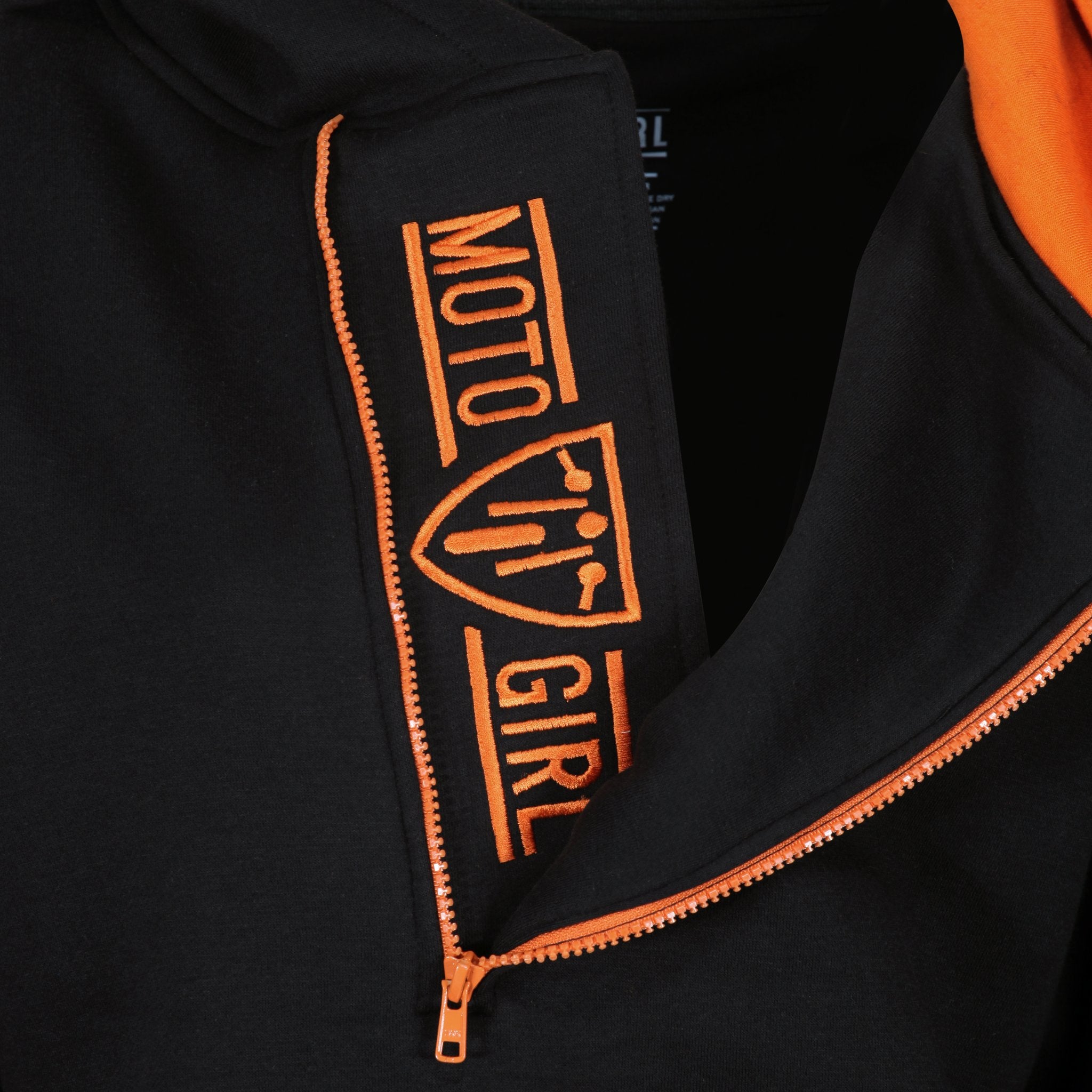 MotoGirl logo on a black and orange motorcycle hoodie with a long zip