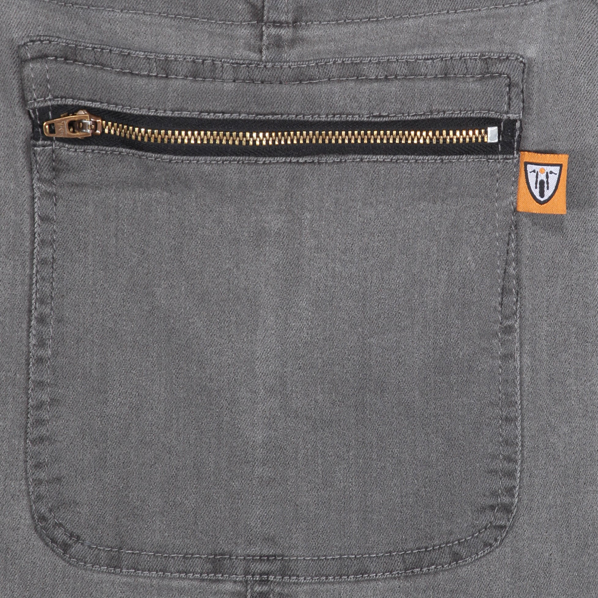 Grey kevlar motorcycle overall for women from Motogirl pocket close up