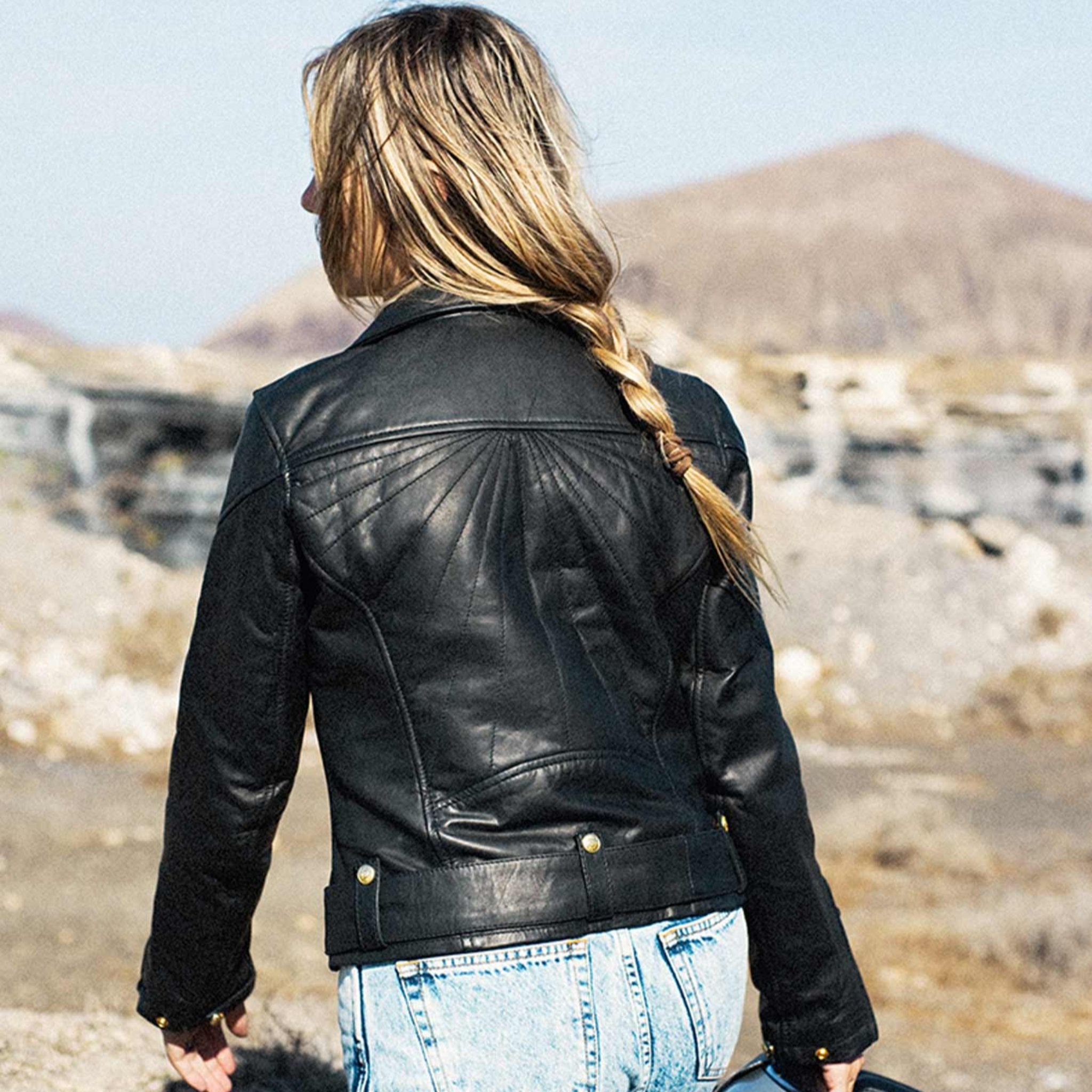 A women from the back wearing Classic retro black women&#39;s motorcycle jacket from Eudoxie