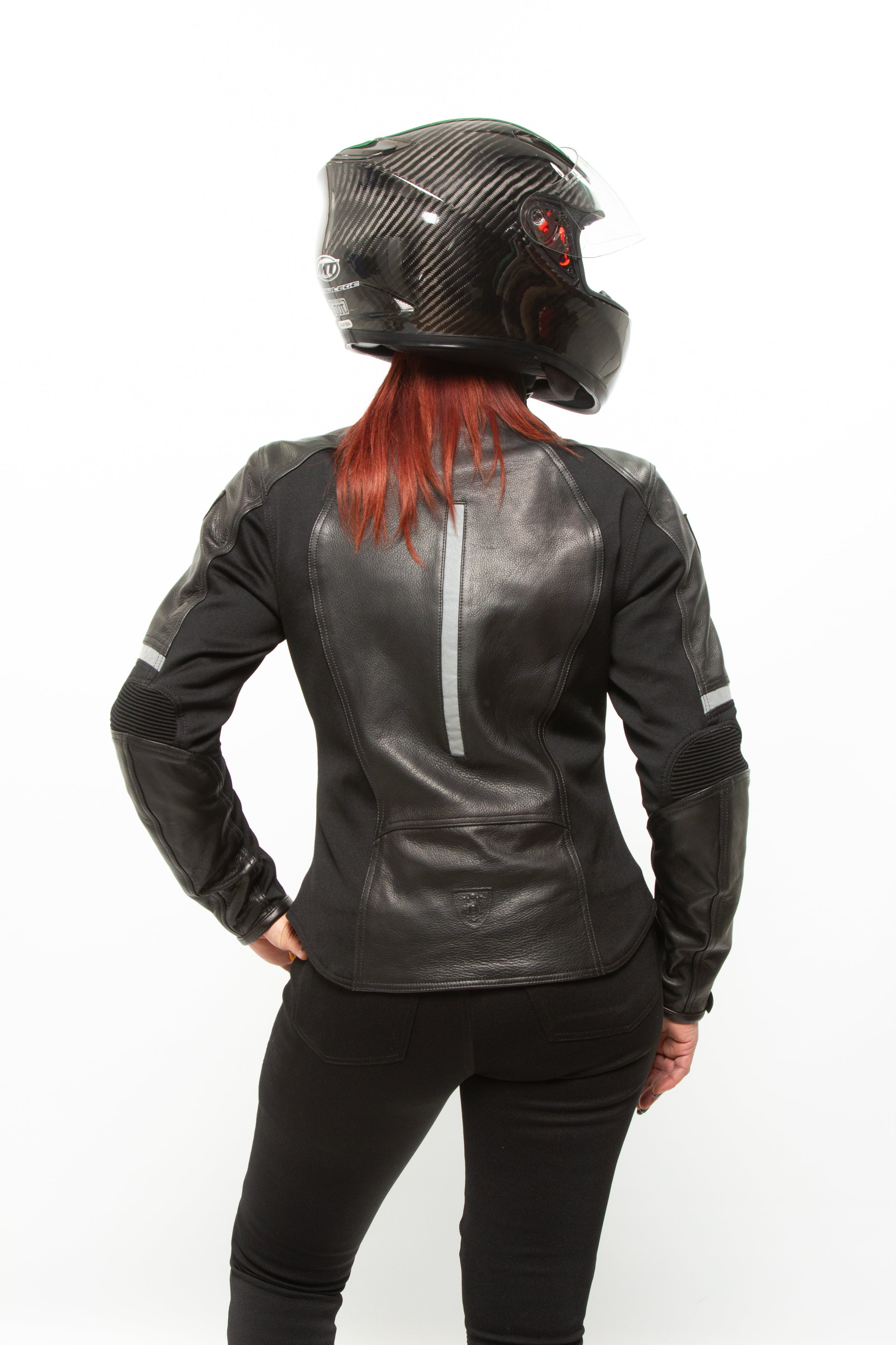 A woman posing with Black leather women&#39;s motorcycle jacket with reflectors from Moto Girl 