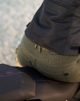 A close up of the back of a woman wearimh Khaki green women's motorcycle cargo pants