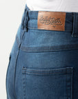 Close up of woman's waist wearing lady blue motorcycle jeans