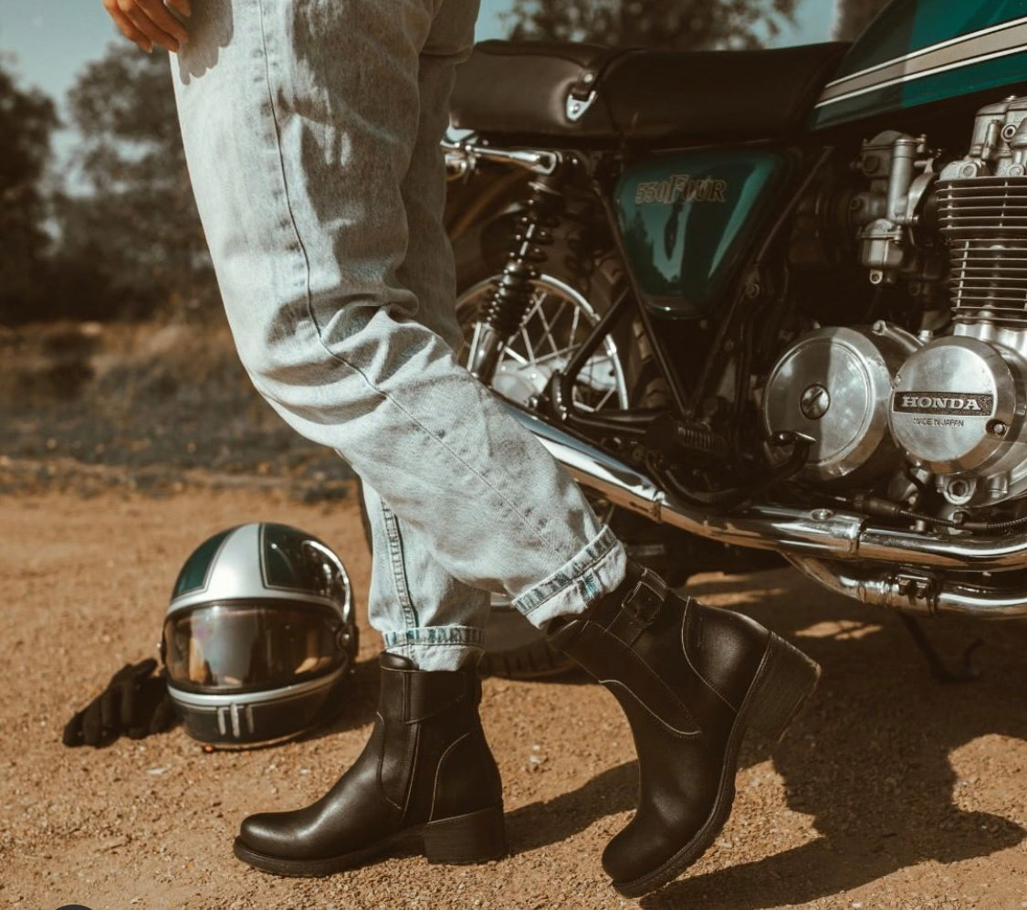 Woman wearing women's black leather motorcycle shoes 
