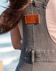 A close up of the Moto Girl patch on the back of women's motorcycle overall 