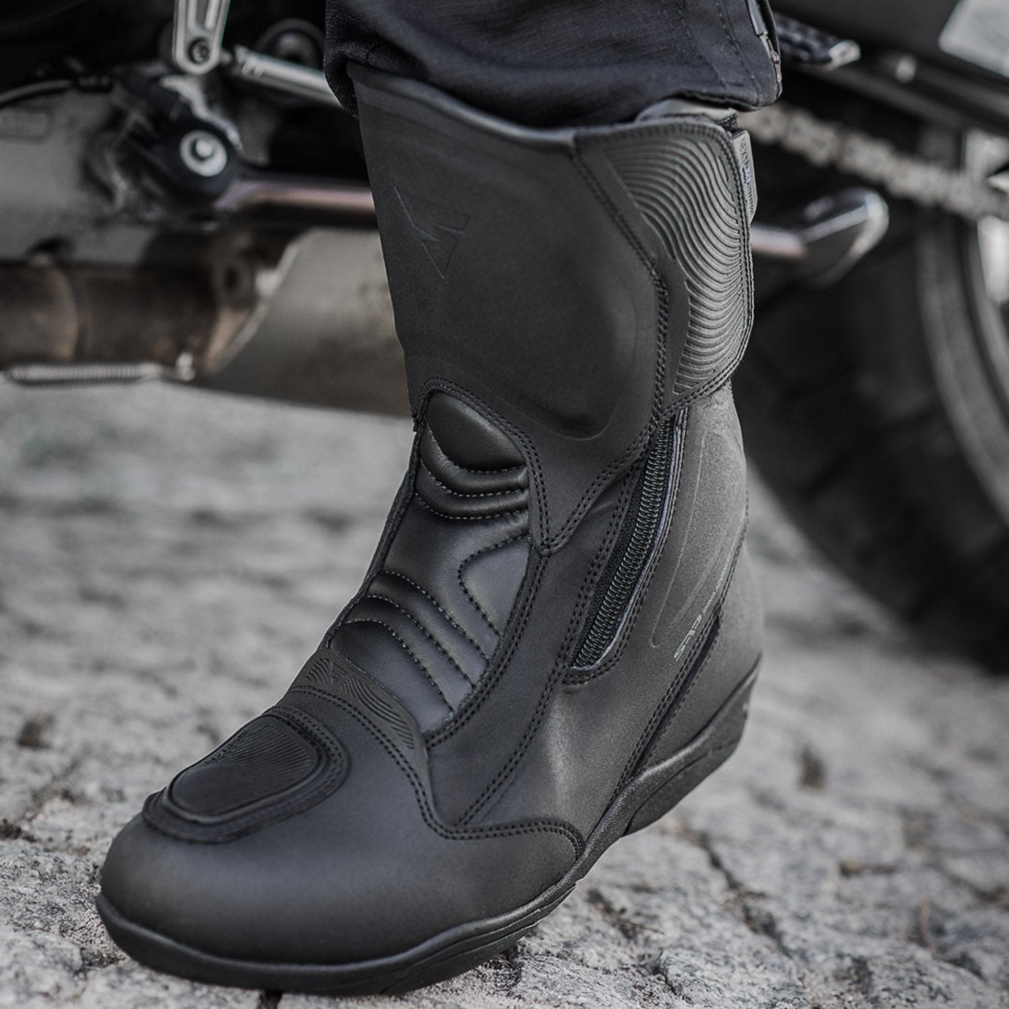 Woman&#39;s foot with a black women&#39;s motorcycle touring boot from Shima