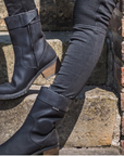 Woman's legs wearing black women's motorcycle boots from Falco 
