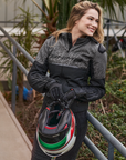 a smilling woman wearing grey motorcycle jacket SHIMA 