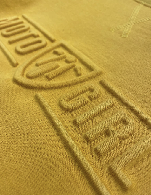 A close up of the 3d logo on a women&#39;s motorcycle sweatshirt from Moto Girl