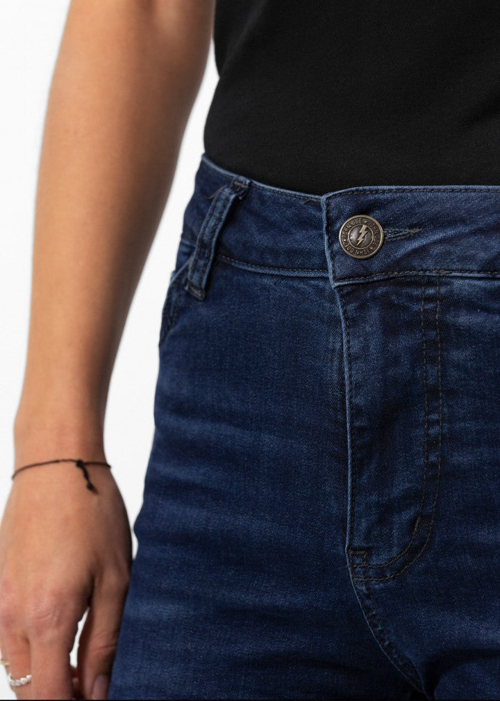 A close up of the button of Woman's legs wearing dark blue high waisted women's motorcycle jeans from JohnDoe