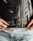 A close up of the belt on the Classic retro black women's motorcycle jacket from Eudoxie