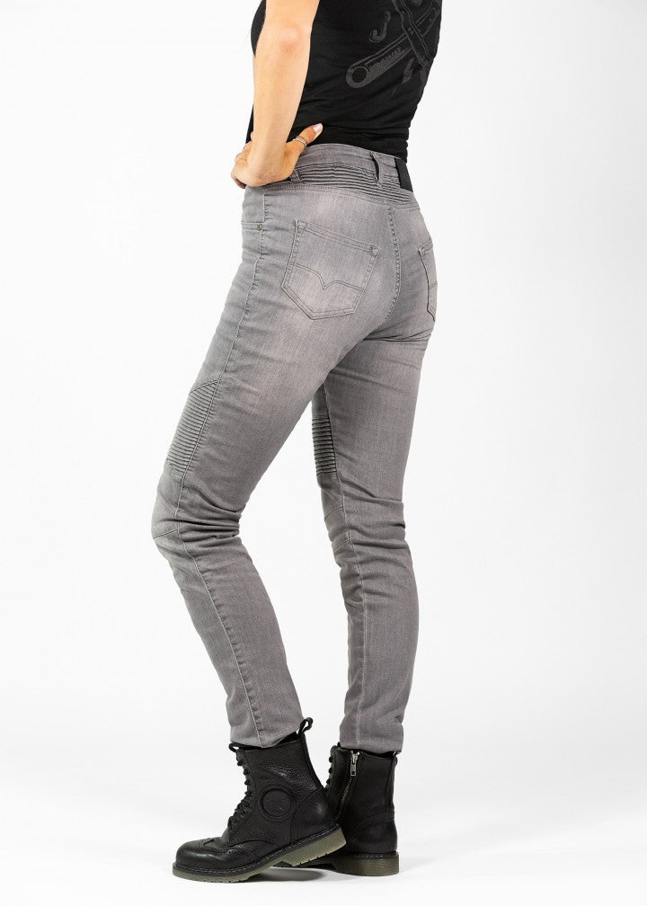 Woman's legs from the side wearing light grey women's motorcycle jeans from JohnDoe
