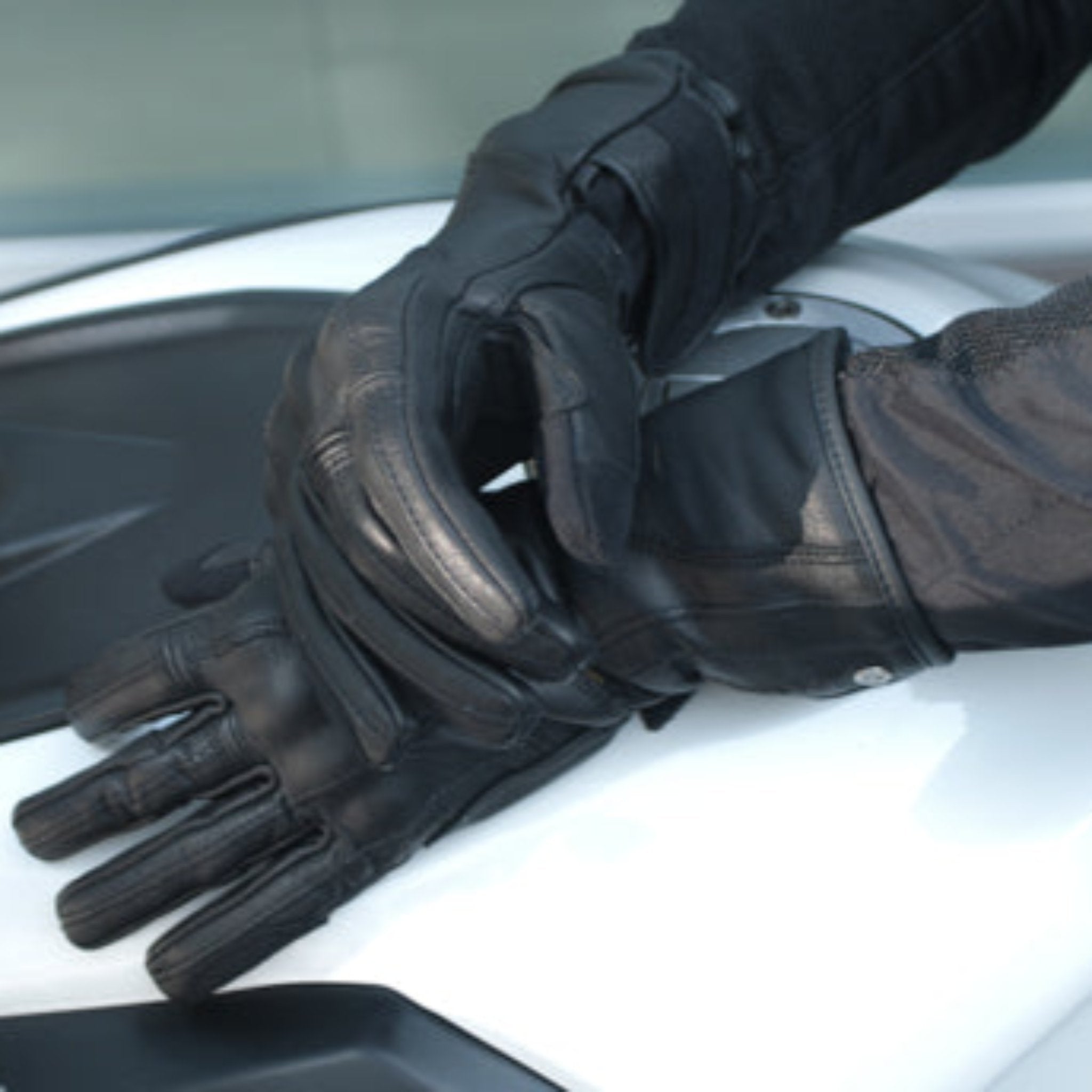 Woman&#39;s hands on the motorcycle wearing Long leather black women&#39;s motorcycle glove