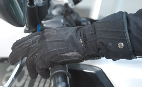 A woman's hand wearing Black long waterproof women's motorcycle glove